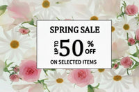 A promotional sale graphic with a white central box reading 'SPRING SALE UP TO 50% OFF' On selected items,' surrounded by a floral border of pink roses and white daisies with yellow centers.