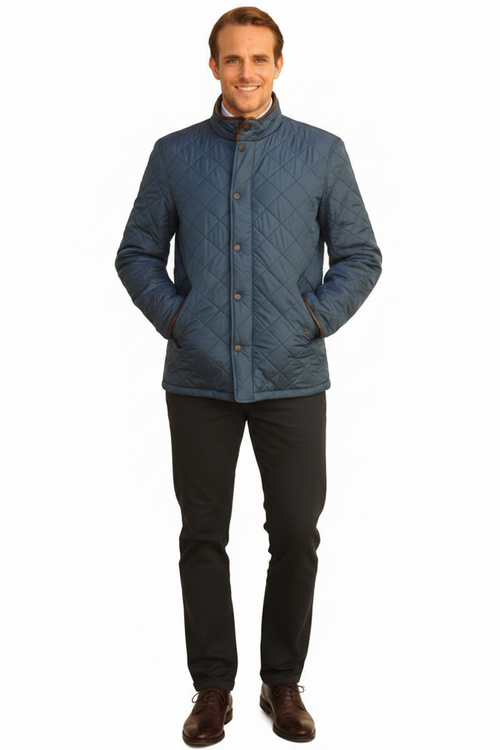Barbour Powell quilted blue jacket worn with dark trousers and brown shoes
