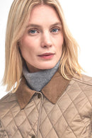Beige quilted jacket with diamond pattern, corduroy-look collar and button front.