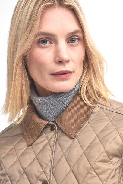 Beige quilted jacket with diamond pattern, corduroy-look collar and button front.