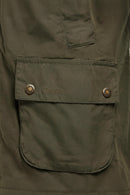 Olive Barbour jacket chest pocket with Barbour logo patch and snap closure