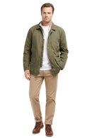 Olive Barbour casual jacket worn with tan chinos and brown boots