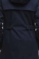 Navy waterproof jacket with belted waist and gold button front
