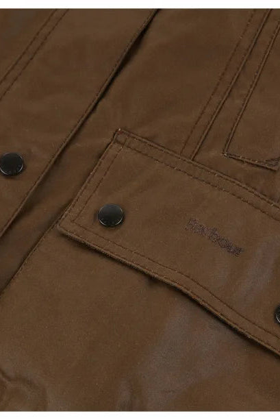 Brown jacket pocket flap with Barbour logo and metal button detail