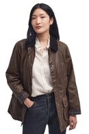 Women's brown waxed jacket with button front, flap pockets, plaid collar lining