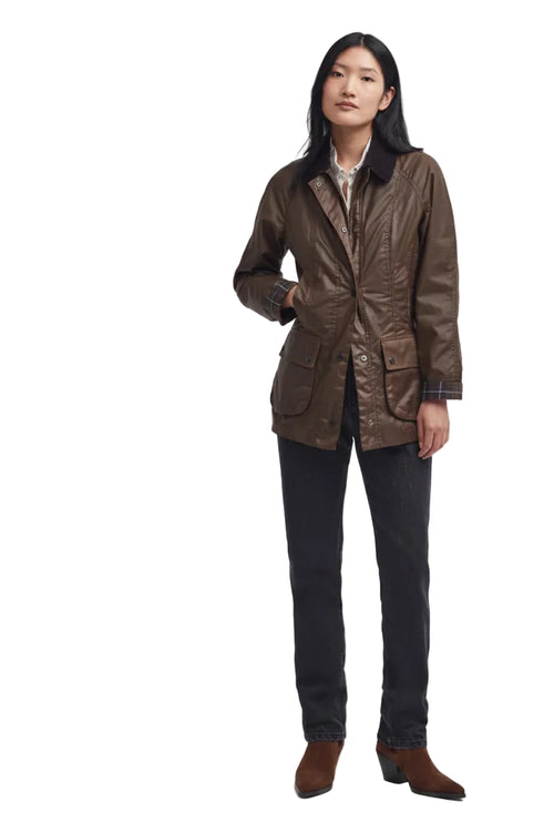 Women's brown waxed Beadnell-style jacket with button front and waist pockets