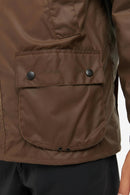Barbour waxed jacket front pocket panel in bark brown with two snap buttons