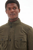 Barbour wax jacket in olive green close-up with stand collar and buttoned chest pockets