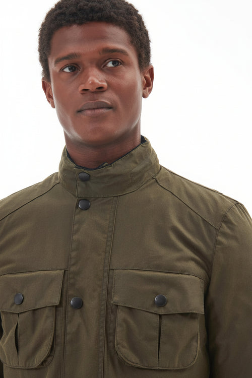 Barbour wax jacket in olive green close-up with stand collar and buttoned chest pockets