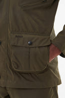 Barbour olive wax jacket detail with snap flap pocket and buttoned yoke