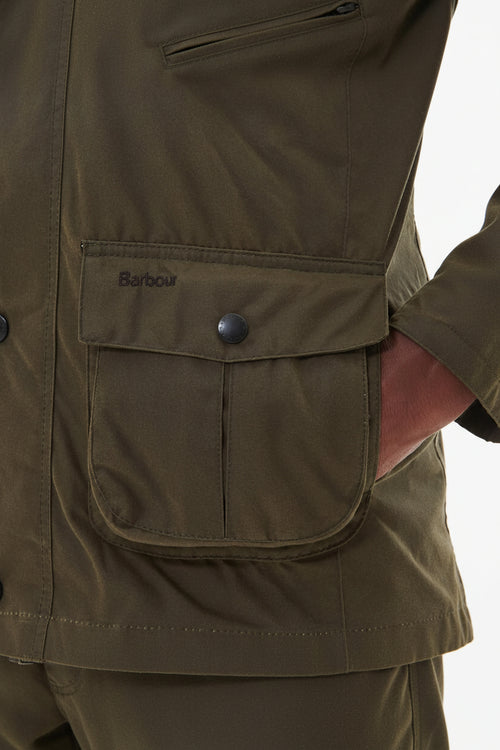 Barbour olive wax jacket detail with snap flap pocket and buttoned yoke