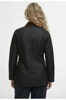 Women’s black wax jacket, back view, vented hem with button side tabs