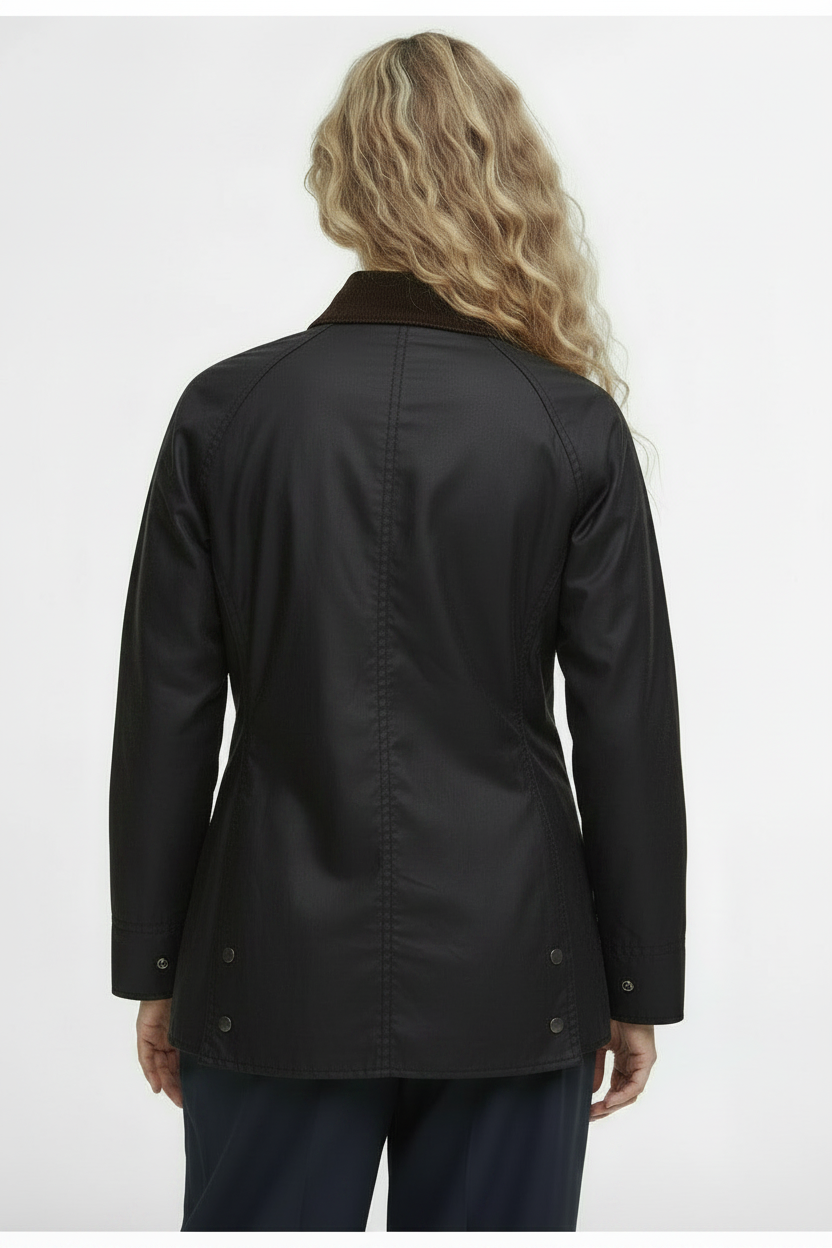 Women’s black wax jacket, back view, vented hem with button side tabs