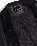 Men's black wax jacket quilted lining with plaid Barbour inner label.