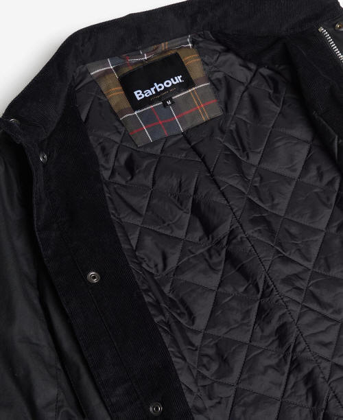 Men's black wax jacket quilted lining with plaid Barbour inner label.
