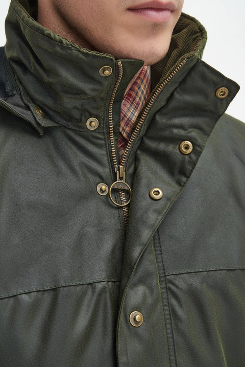 Men's dark green waxed jacket with snap button placket and stand collar, front view.