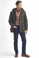 Men's dark green waxed jacket with hood and front zip, layered over a plaid shirt.