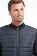 Navy zip-through sweater with stand collar, ribbed trim, quilted front