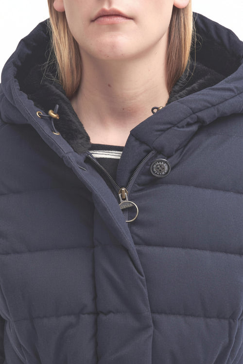 Navy hooded puffer jacket with zip front, snap buttons, and metal ring detail