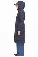 Navy side view of long hooded puffer jacket with quilted sections