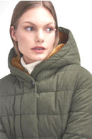 Olive hooded puffer jacket close-up with quilted panels and snap-button collar.