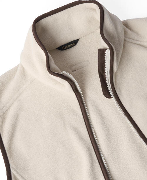 Cream fleece gilet interior view with zip track and Barbour logo label