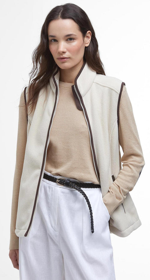 Cream fleece gilet vest with front zip, contrast piping, and side pocket openings