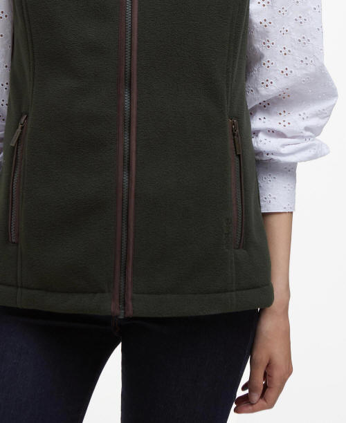 Sage green fleece gilet detail showing front zip and side zip pocket.
