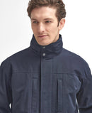 Men's navy waterproof jacket with high stand collar and two buttoned front pockets.