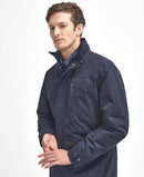 Men's navy waterproof jacket side profile with adjustable cuffs and pocket flaps.