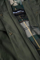 Barbour logo label on plaid lining inside olive waterproof jacket collar close-up