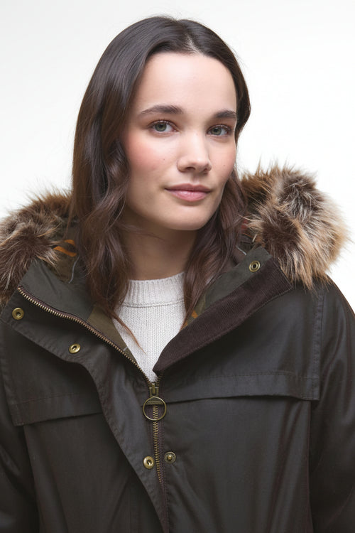 Dark waxed parka with fur-trimmed hood and zip-front, gold snap buttons