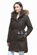 Dark waxed parka with fur-trimmed hood, drawstring waist, front patch pockets