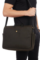 Olive wax messenger bag with front pocket and adjustable shoulder strap