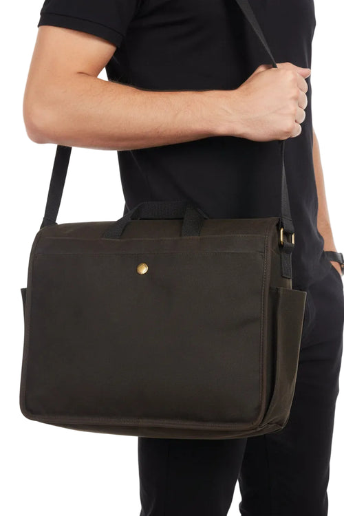 Olive wax messenger bag with front pocket and adjustable shoulder strap