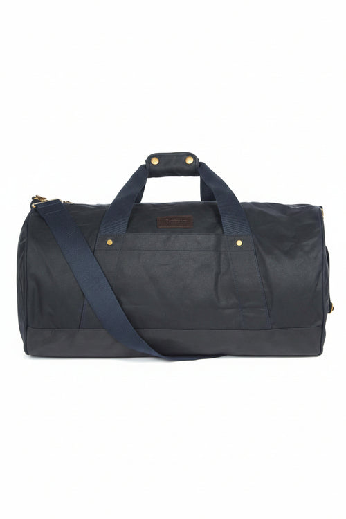Barbour wax duffle bag in dark navy with wide handles and brass studs