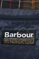Barbour care label on dark navy wax duffle bag front patch