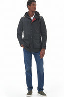 Men's Barbour wax parka in dark color with hood and multiple flap pockets