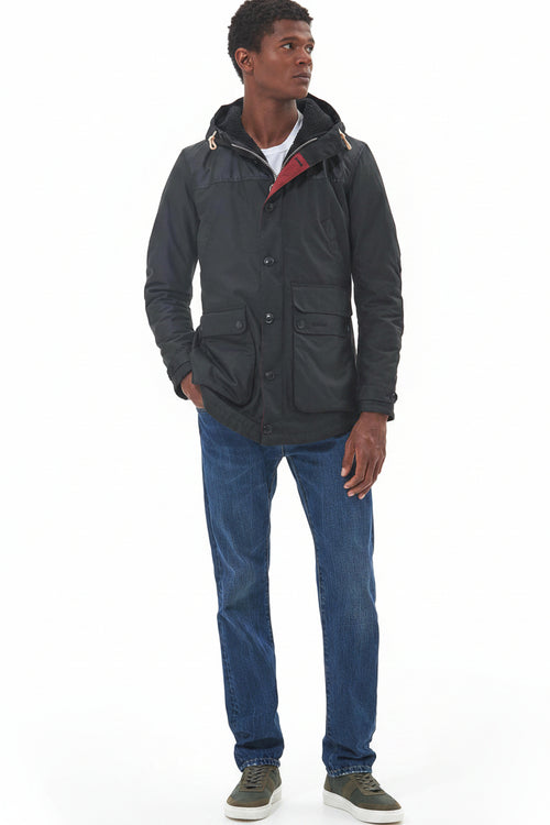 Men's Barbour wax parka in dark color with hood and multiple flap pockets