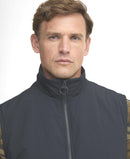 Navy gilet vest with stand collar and central front zip, worn over plaid shirt