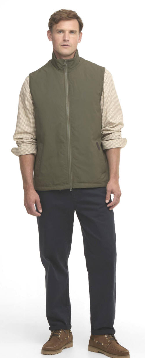 Olive zip-front gilet over check-pattern shirt sleeves