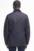 Men's navy quilted jacket back with diamond quilting and two-button hem tabs