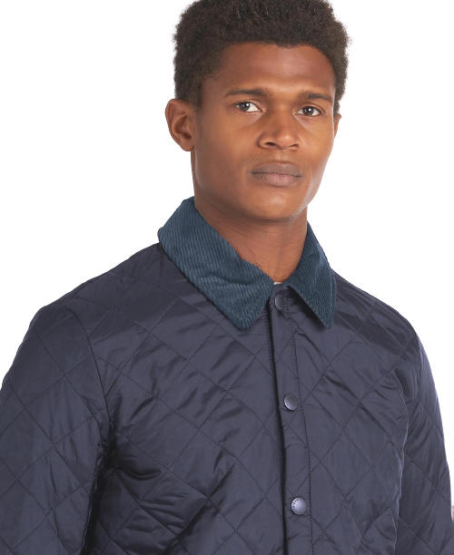 Men's navy quilted jacket with stand collar and metal button front