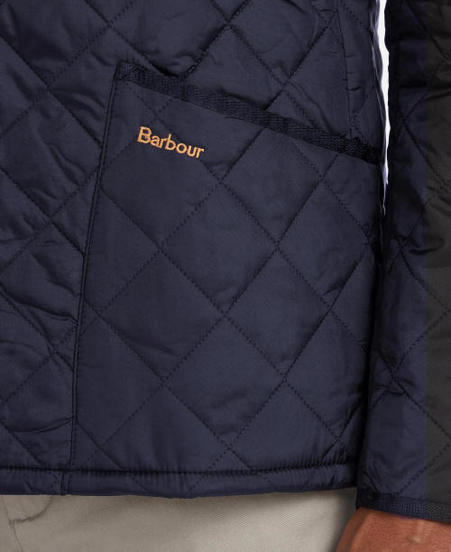 Men's navy quilted jacket front, Barbour logo patch, diamond stitch
