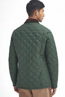 Quilted racing green jacket back view with diamond stitching and buttoned hem