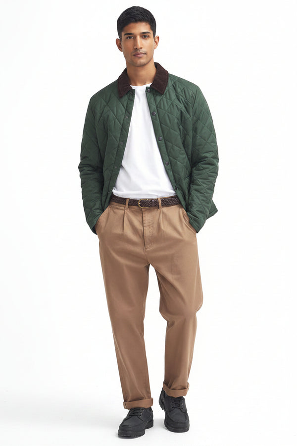 Quilted racing green jacket worn open over white tee with maroon-brown collar