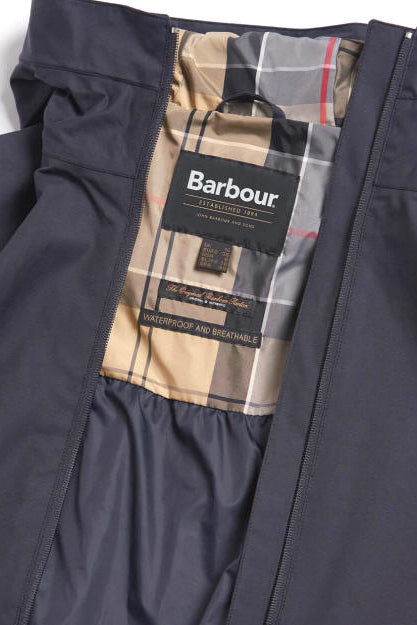 Navy jacket interior lining with Barbour label and plaid waterproof and breathable text