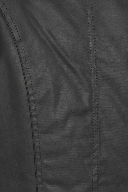 Barbour waxed waterproof coat fabric panel with visible stitched seams, black