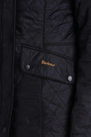 Black ladies quilted polarquilt jacket with zip front and snap button placket
