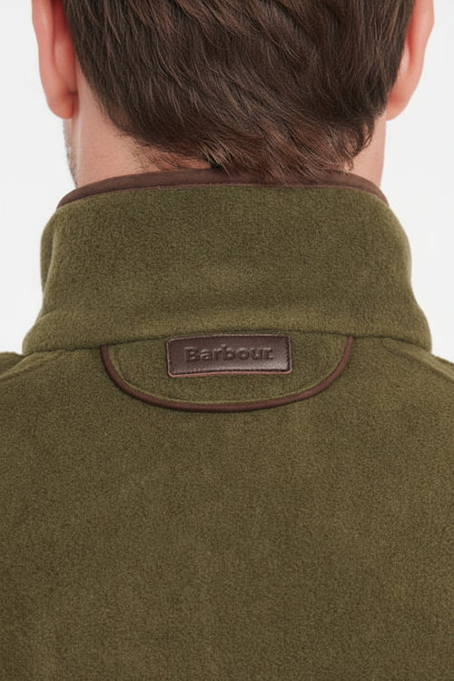 Olive fleece waistcoat neck label with stitched trim and stand collar.